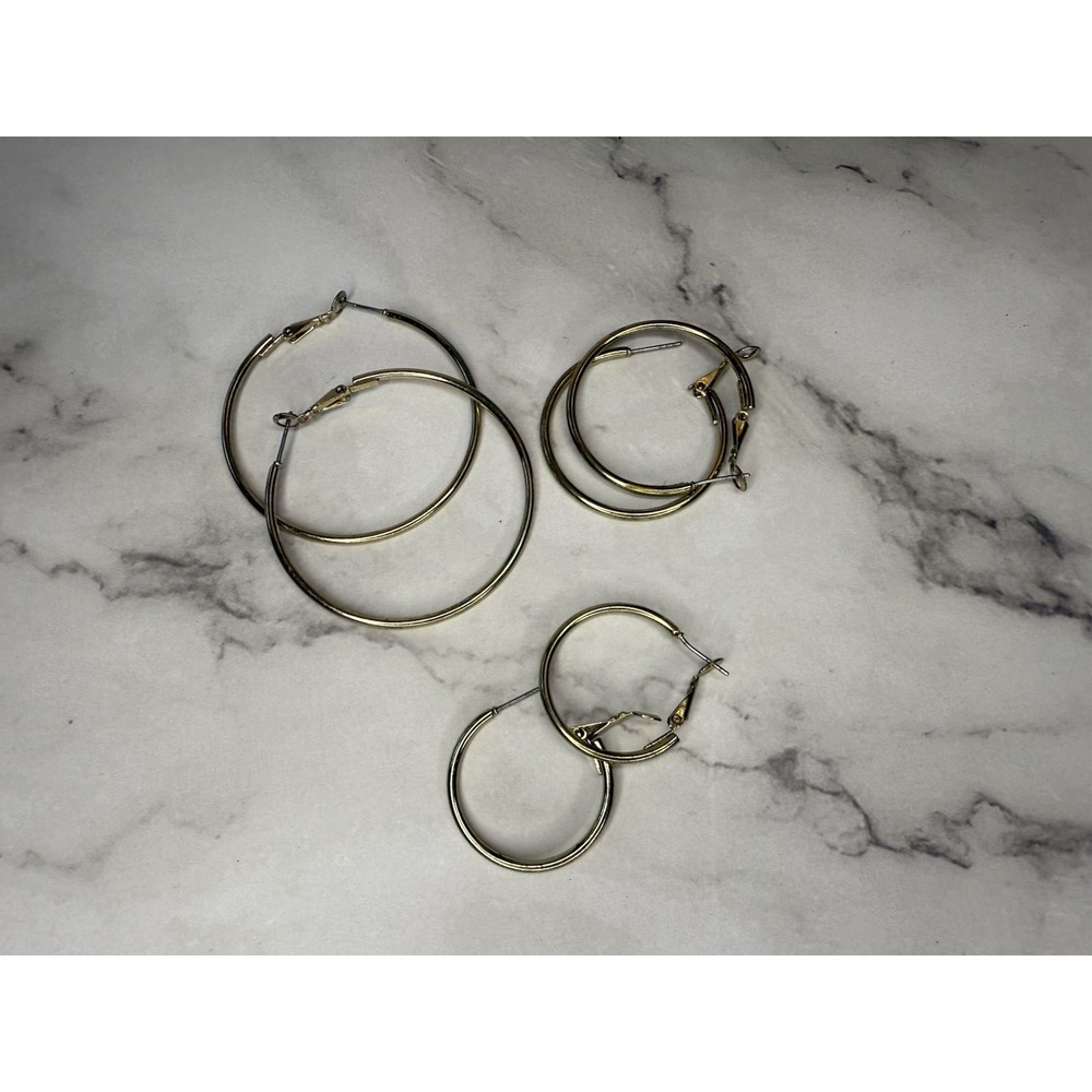 NOT AVAILABLE - SOLD set of 3 gold tone hoop earrings varying sizes
